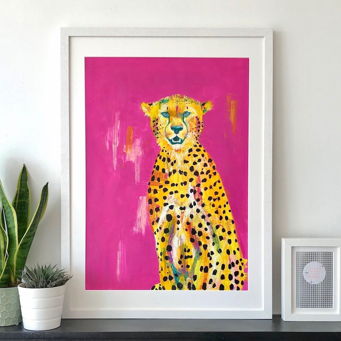 painting of cheetah on bright pink background