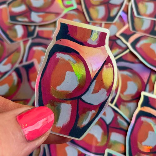Holographic butt sticker on top of lots of butt stickers