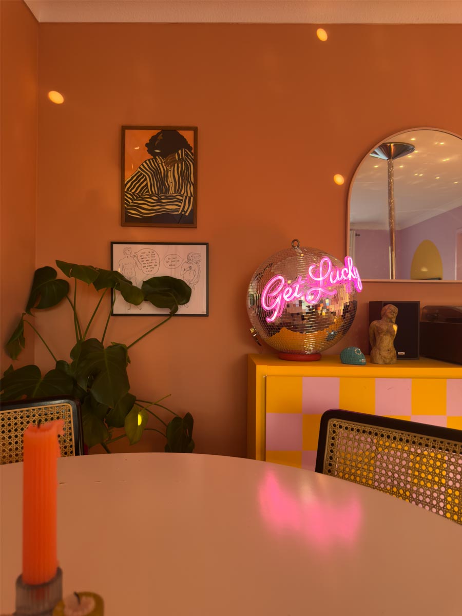 Terracotta-living-room-with-discoball-lights-Georgie-Web-Art-Bristol