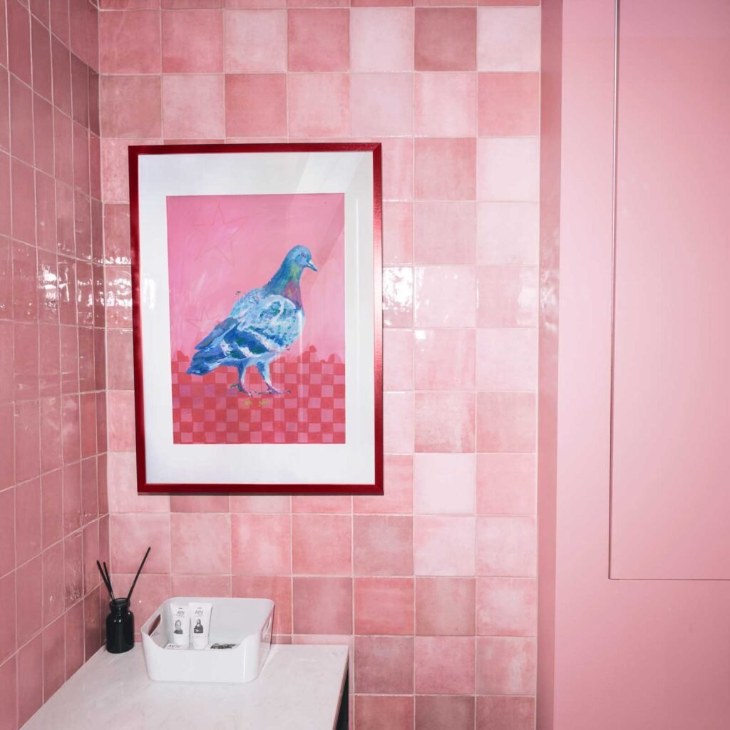 pigeon on a pink background with a pink and red checkerboard floor.