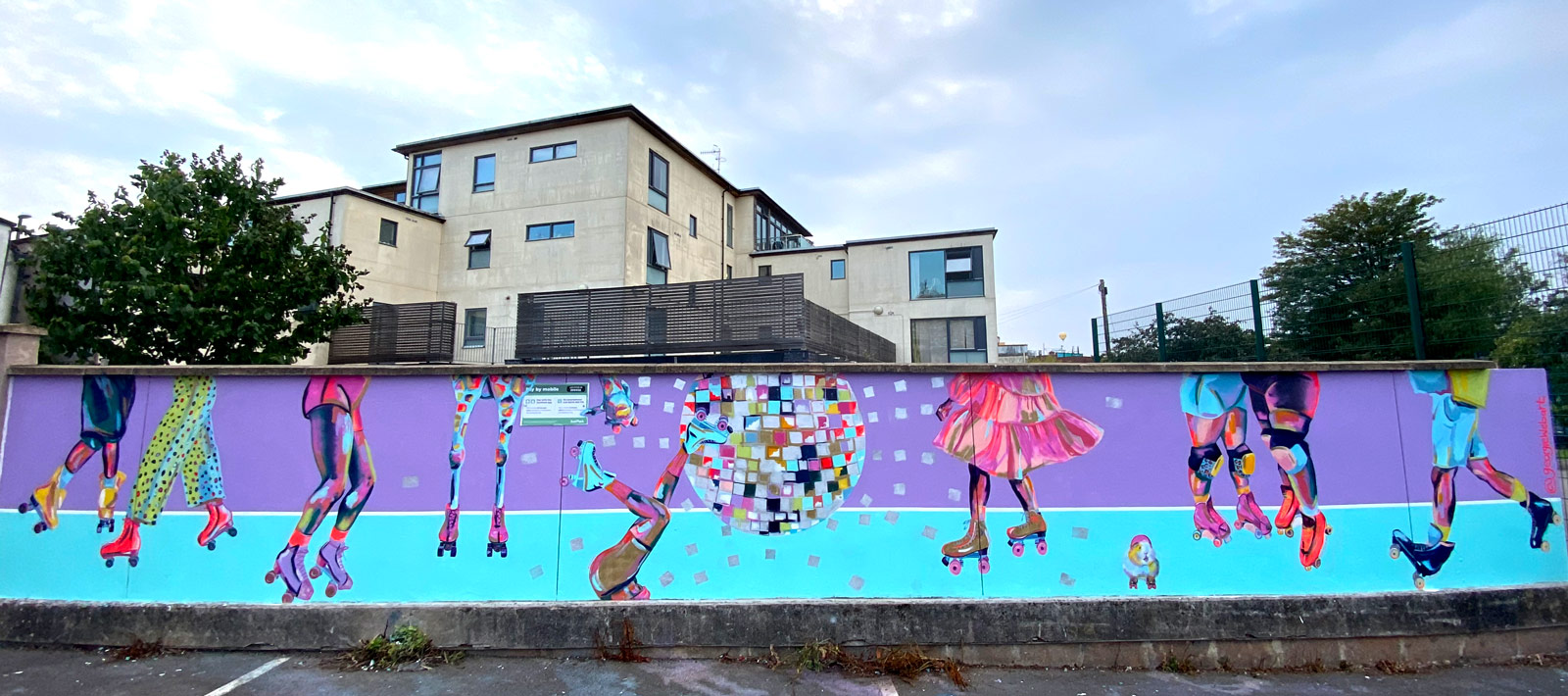 Lilac and blue, roller skating mural with large disco ball